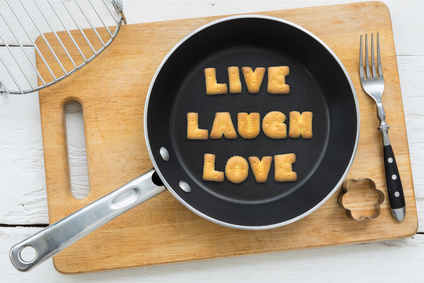 Frying pan with fried bread spelling 'Live, laugh. love'