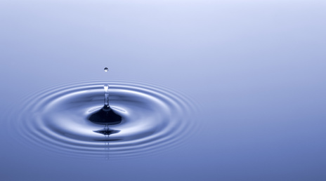 Photo of a drip of water making ripples