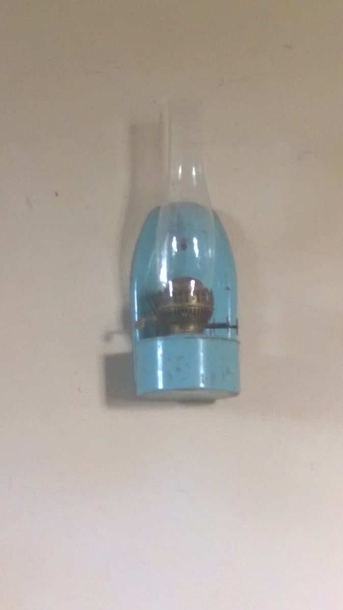 Oil lamp on wall in All Saint's Church Shorncote