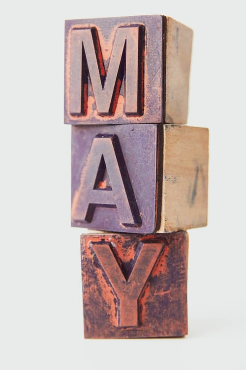Wood blocks spell the word May