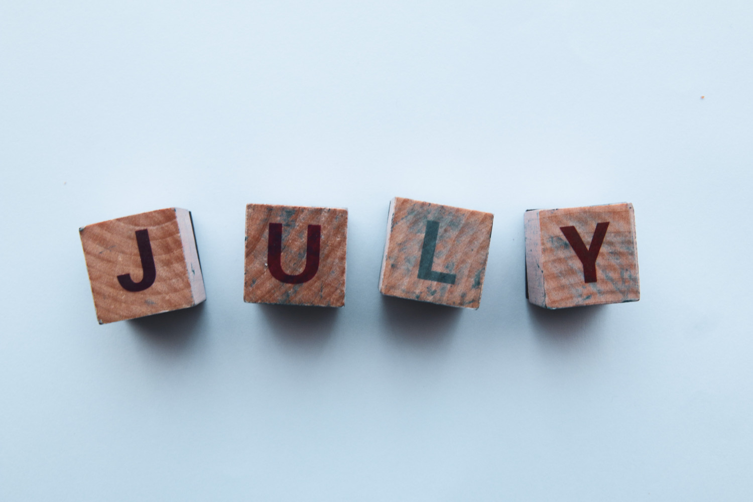 July written on wooden blocks