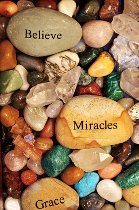 Stones with the words 'Believe' , 'Miracles' and 'Grace'.